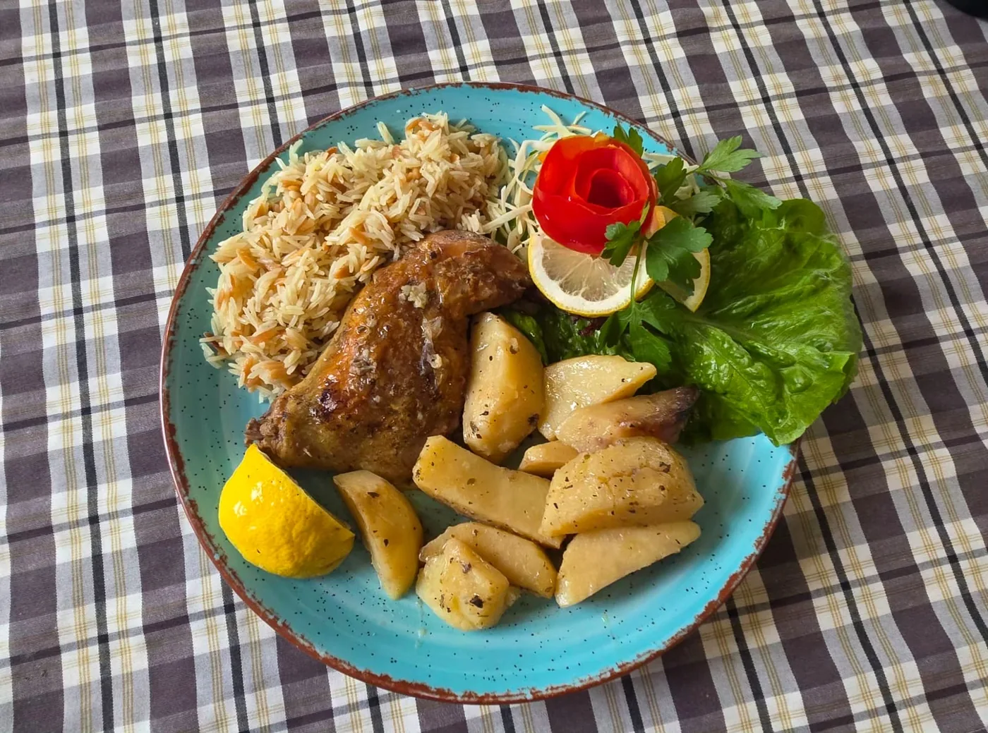 Chicken lemonato with pilaf rice and lemon potatoes