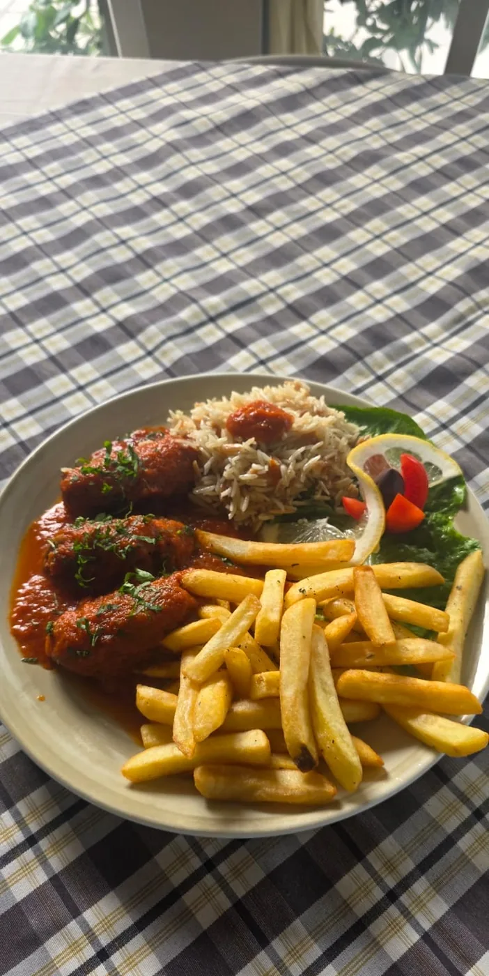 Soutzoukakia in tomato sauce with rice and fries